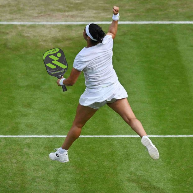 woman single celebrating in pickleball court